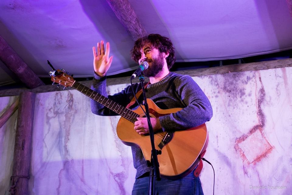 Jon Bailey waving at a show, ReverbNation photo